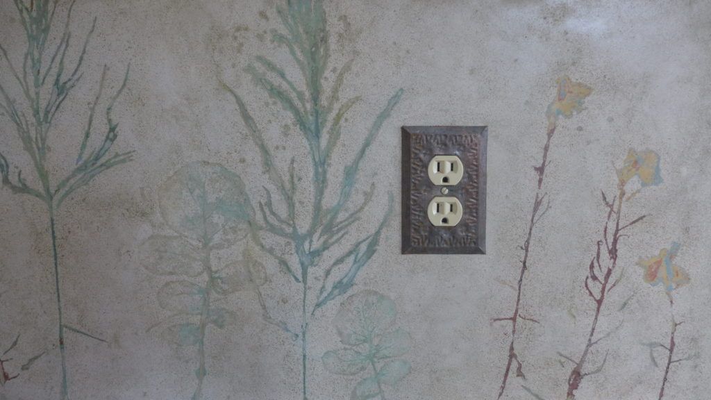 Leafy Concrete Backsplash with Outlet with miscanthus grass emphasized