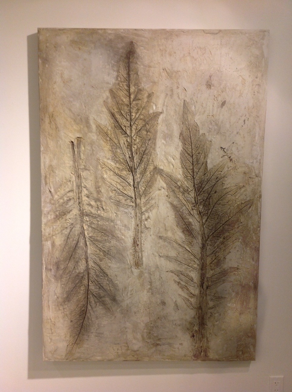 Mid-sized concrete panel with three vertical artichoke leaf impressions