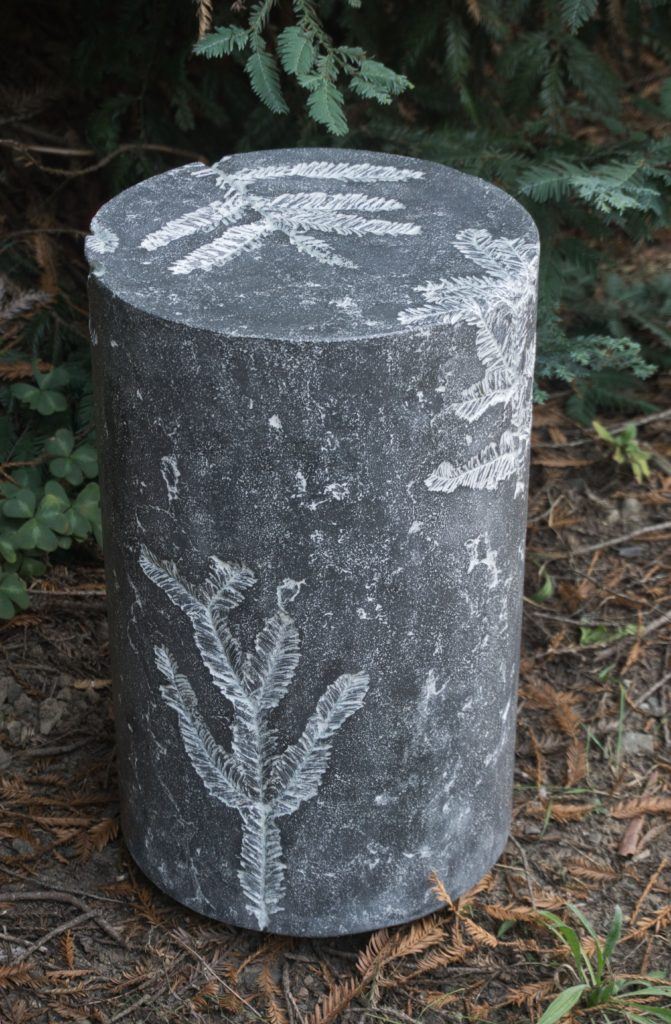 Dark Grey Concrete stool or accent table with white, textural redwood leaf impressions