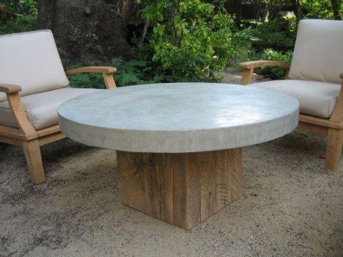 coffee table with round thick concrete top with cypress square base in outdoor environment