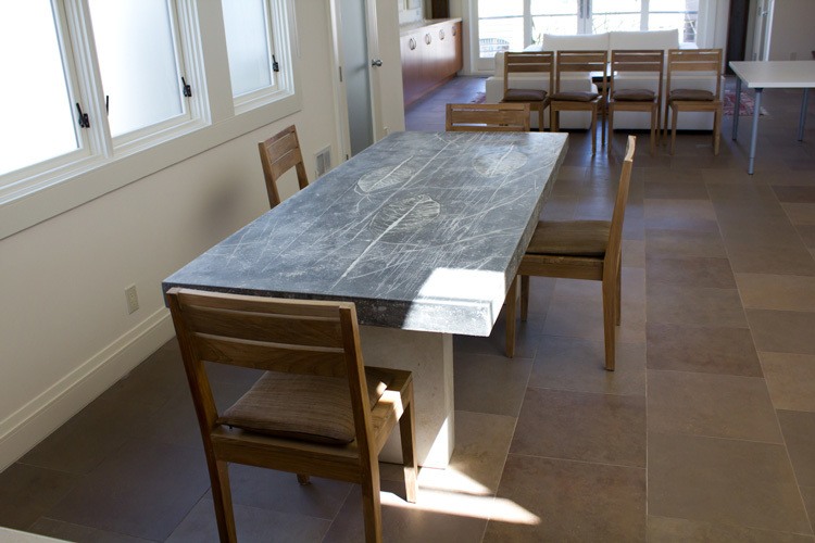dining table with leaf impressions on concrete base