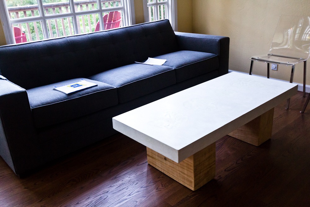 concrete coffee table with thick white top on square cypress block base