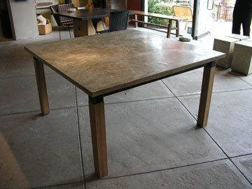 square concrete dining table with wood leg base