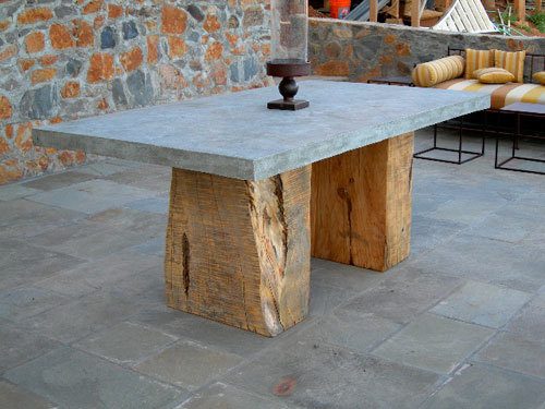 concrete dining table with raw cypress split slab base