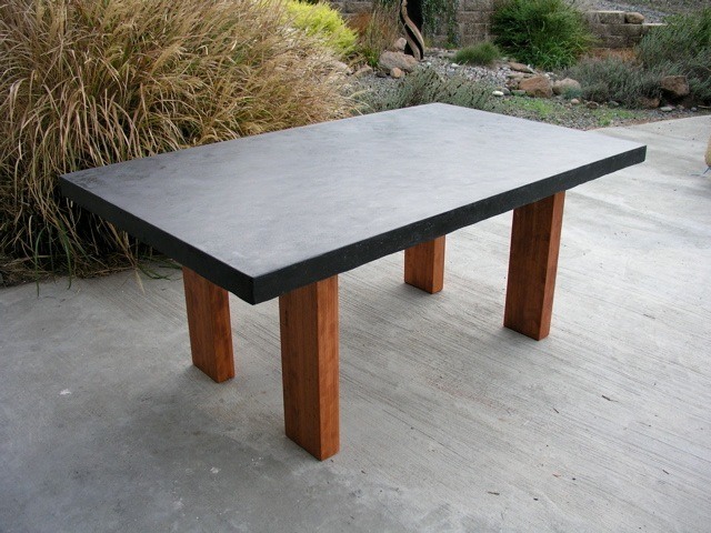 concrete dining table on wood base