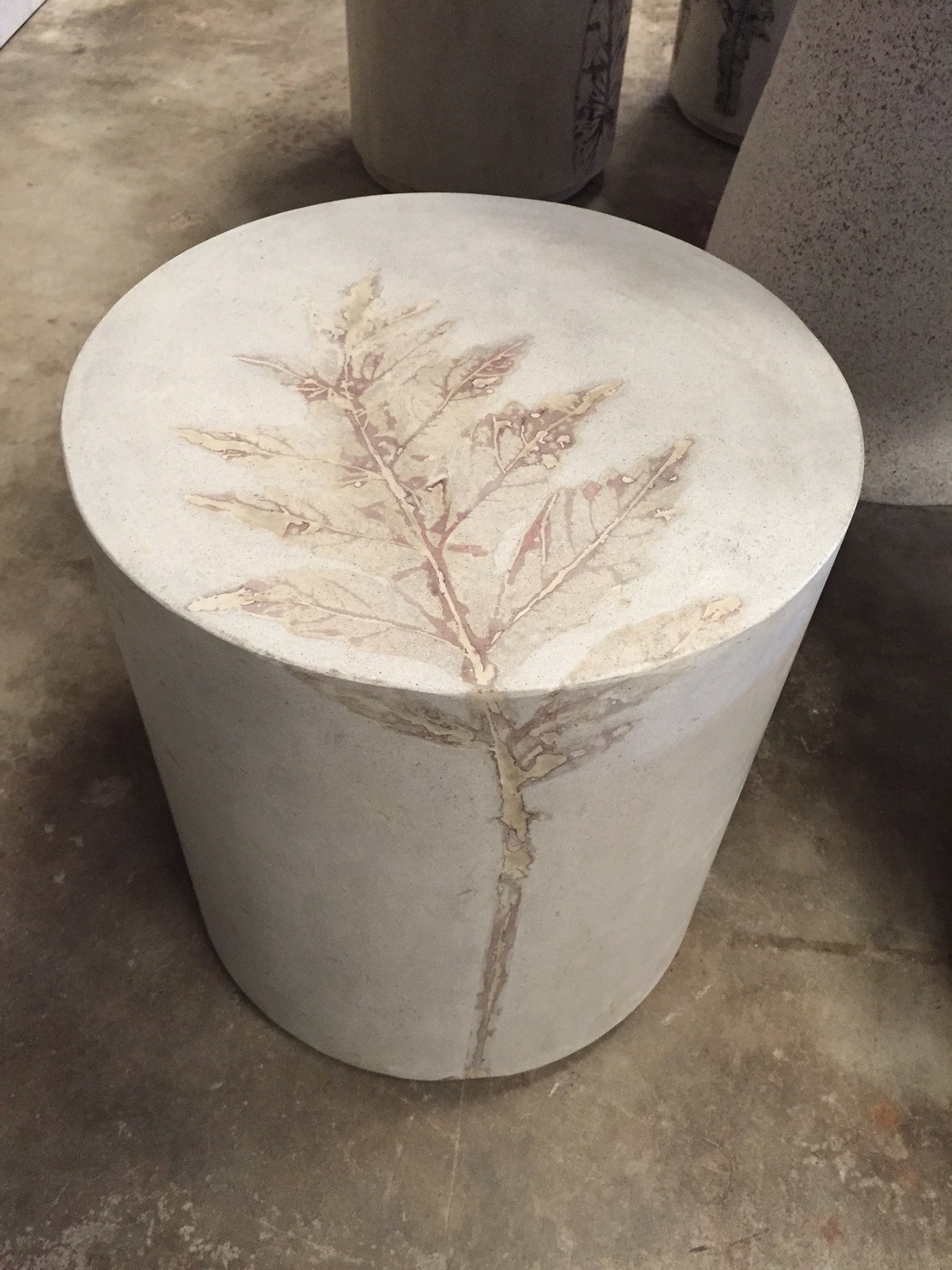 Concrete Pliny end table with artichoke leaf impression