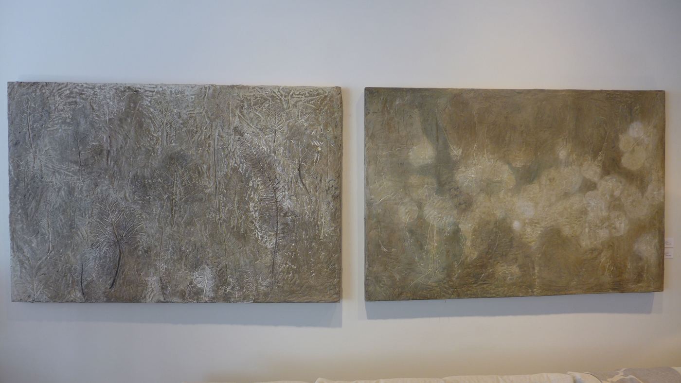 two concrete wall panels with various botanical impressions