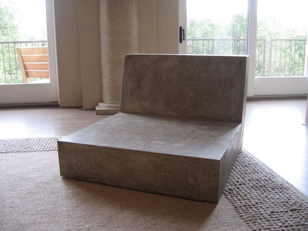 Large brown concrete low loveseat in contemporary living room