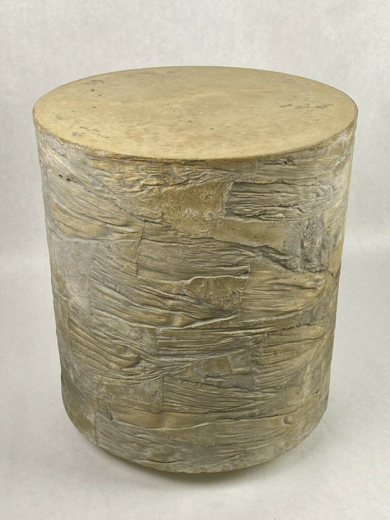 Switchback: Yellow concrete side table with numerous sideways corn husk impressions on sides