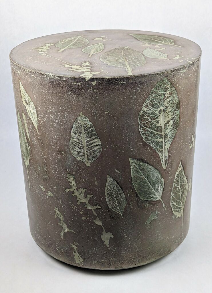 Brown concrete side or end table with sage leaf impressions