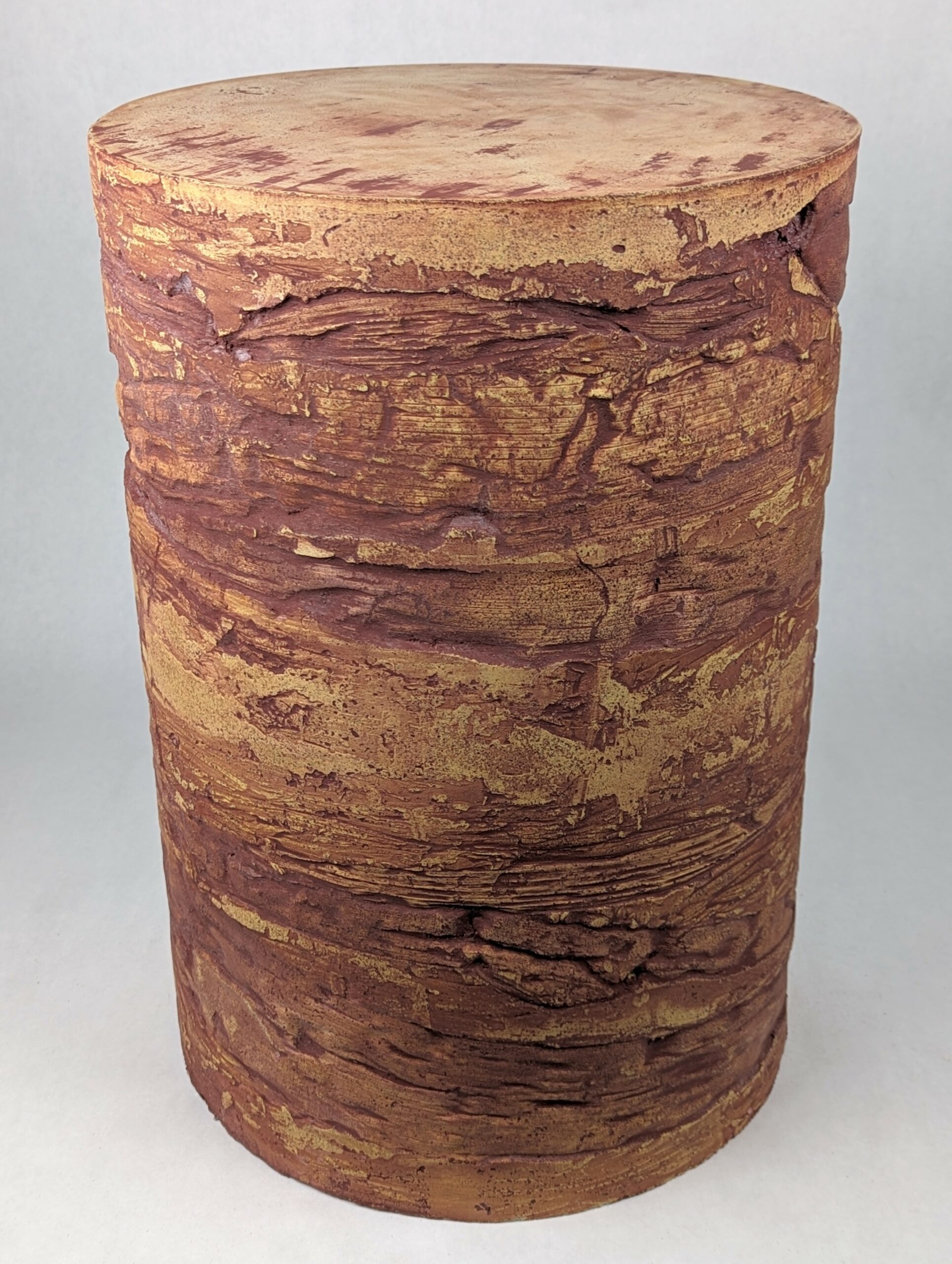 Caput Mortuum: yellowish concrete side table with caput mortuum colored fill in rustic palm leaf impressions, 14" diameter x 20" tall