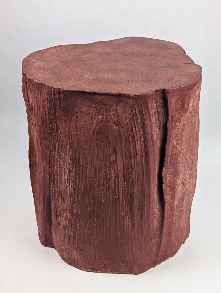 Red concrete palm seedpod side table, side shot