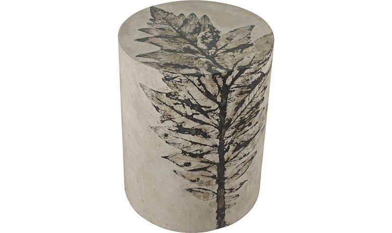 Round Beige 16" x 20" tall concrete side table with large black and brown cardoon leaf impression on top and side
