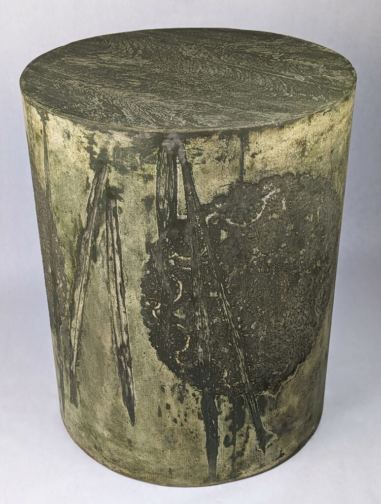 Unearthed Lineage: green and yellow rustic concrete side table with intricate metalllic patterning and grass blade impressions