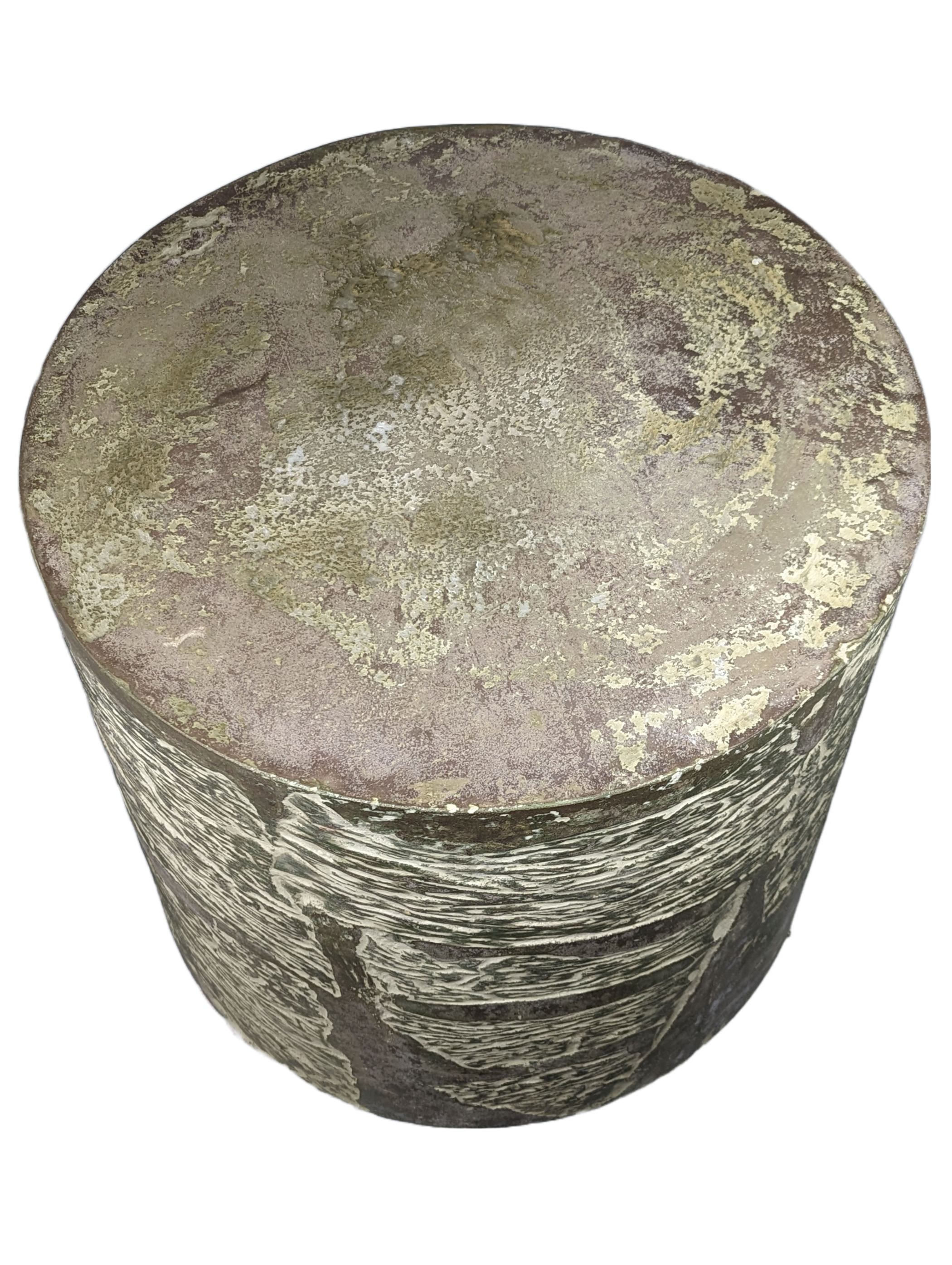 Concrete coffee table, round with mottled greens and browns on top and lines on side