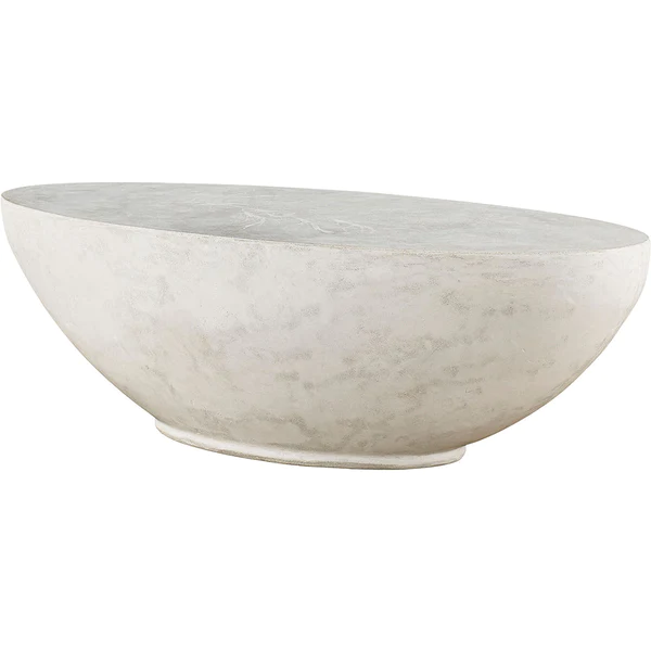 white oval concrete cocktail or coffee table with miscanthus grass seedhead impressions grouted on top