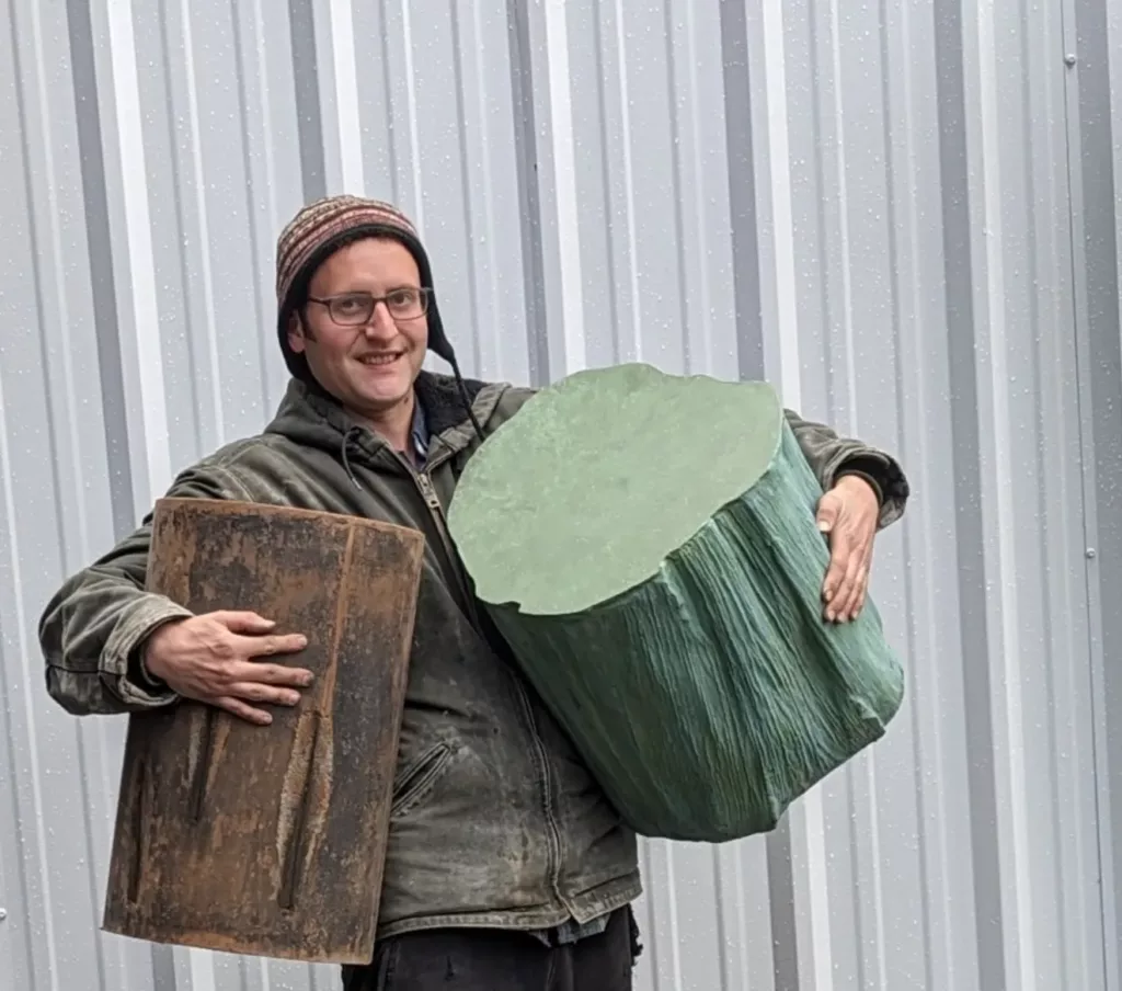 Business owner Ryder Holmes Wilson carrying two concrete stools easily