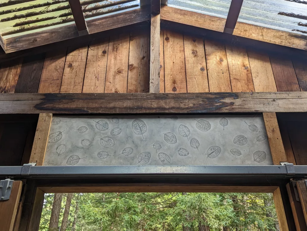 concrete panel with smokebush leaf impressions over mudroom entryway