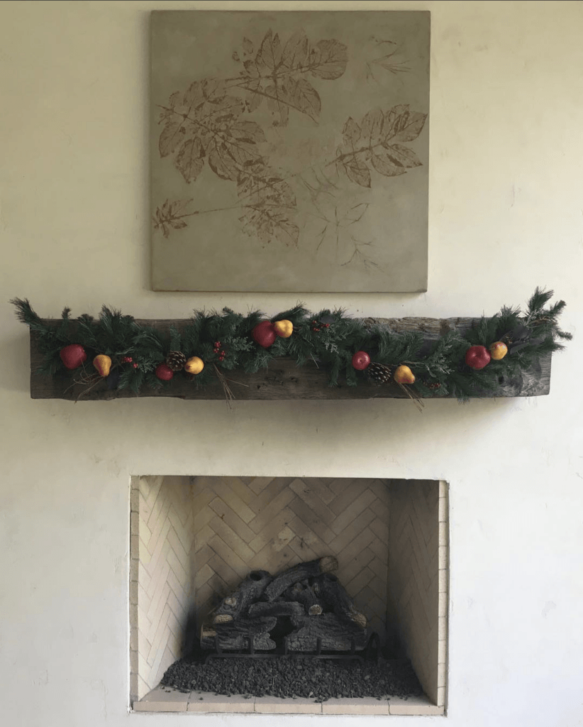 concrete panel over fireplace with potato leaf design
