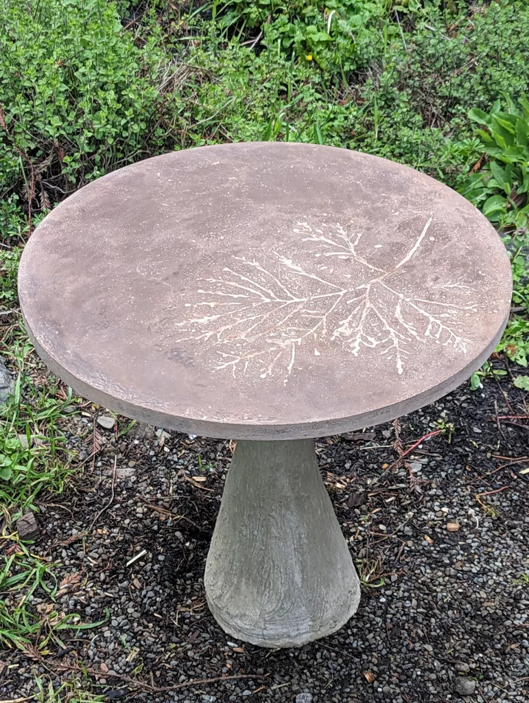 Brown concrete 24" table top on tapered base