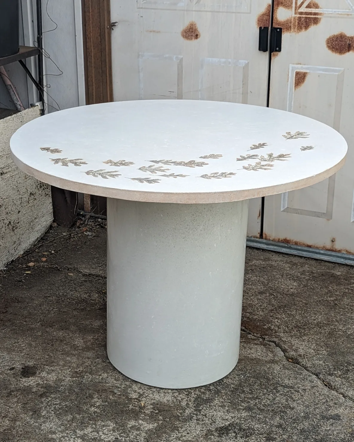 White Concrete Dining Table on Pillar base with oak leaf imprints